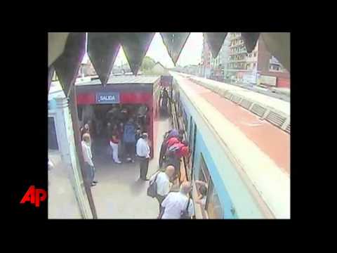 Youtube: Raw Video: Train Spares Girl Lowered Onto Tracks