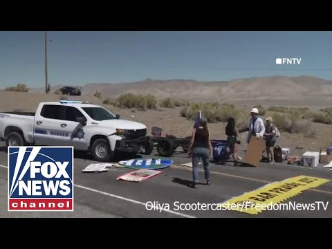 Youtube: Police plow through climate protest, arrest activists blocking traffic