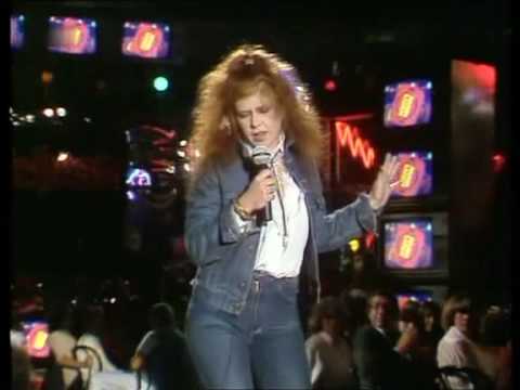Youtube: Kirsty MacColl - There's a guy works down the chip shop, swears he's Elvis 1981