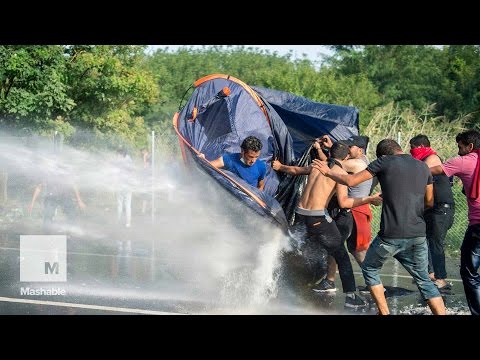 Youtube: Hungary Unleashes Water Cannons on Migrants at Border | Mashable News