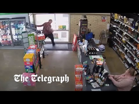 Youtube: Thief trying to steal beer trapped by quick-thinking shopkeeper