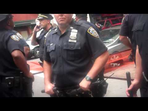 Youtube: Cops turn Violent, NYPD drag girl across the street. #OccupyWallStreet