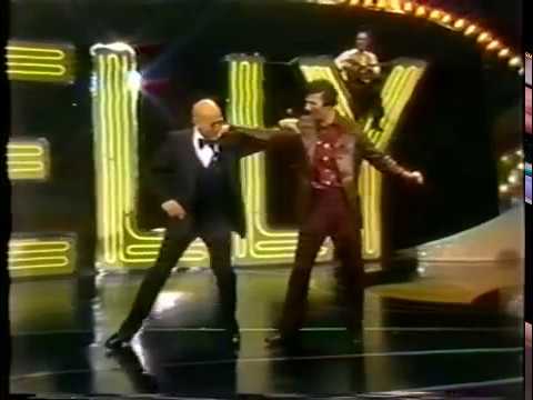 Youtube: Telly Savalas  -  Telly ... Who Loves Ya, Baby 1976 - Greek Dance