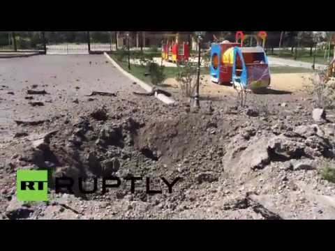 Youtube: Ukraine: See massive bomb crater by kids' playground