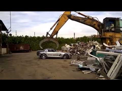 Youtube: Mercedes SLS AMG  being completely destroyed in a scrap yard.