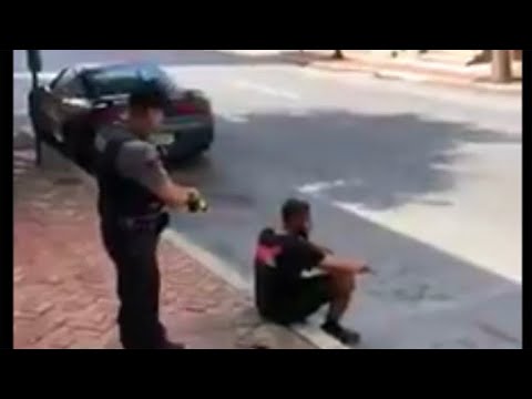 Youtube: Video shows officer using stun gun on man sitting on sidewalk