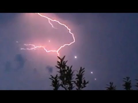 Youtube: Spectacular UFOs flying through Lightning Strike, June 2014