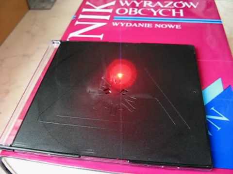 Youtube: Self made CNC machine with DVD writer laser burns laser hazard logo on CD case