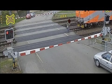 Youtube: Incredible: Pensioner hit by train on level crossing and walks away uninjured