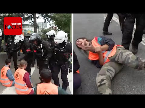 Youtube: Pariser Polizei reißt festgeklebte Klima-Aktivisten von der Straße