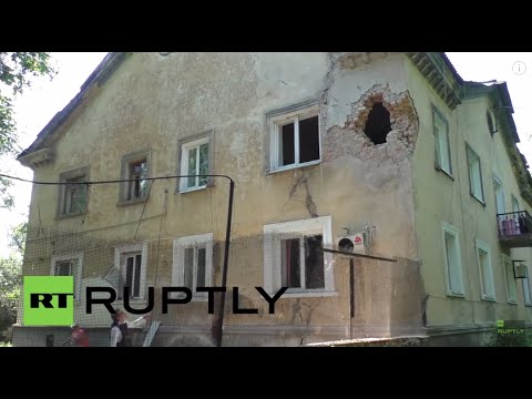 Youtube: Ukraine: OSCE workers inspect shelling aftermath, alongside DNR's Basurin