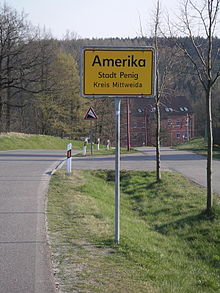 220px-Ortsschild-amerika