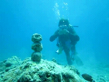 Diver-Knocks-Down-Rocks-With-Ring-Bubble
